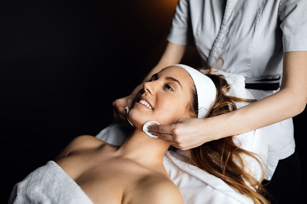 Image of a woman getting a spa facial.